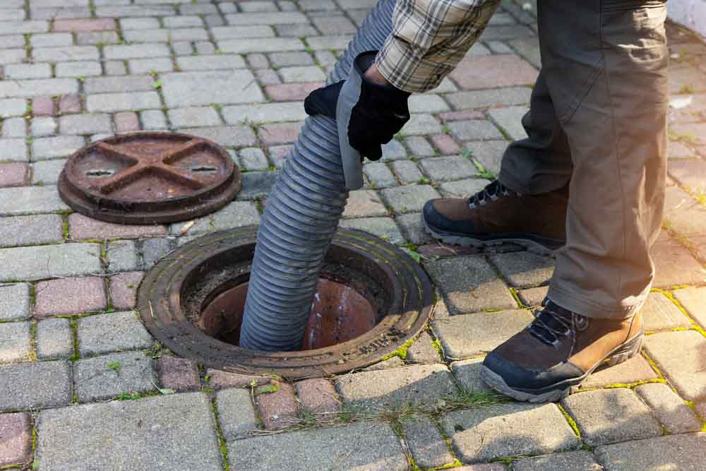 Sweet’s Services technician pumping a septic tank